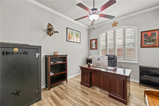 a work space with wooden floor and furniture