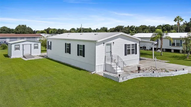 a view of a house with a yard porch and sitting area
