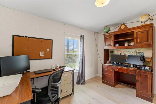 a bathroom with a sink a toilet and shower curtain