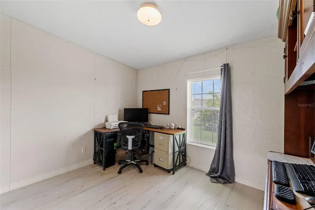 a bathroom with a sink a toilet and shower curtain