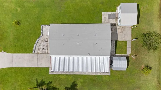 an aerial view of a house with a garden