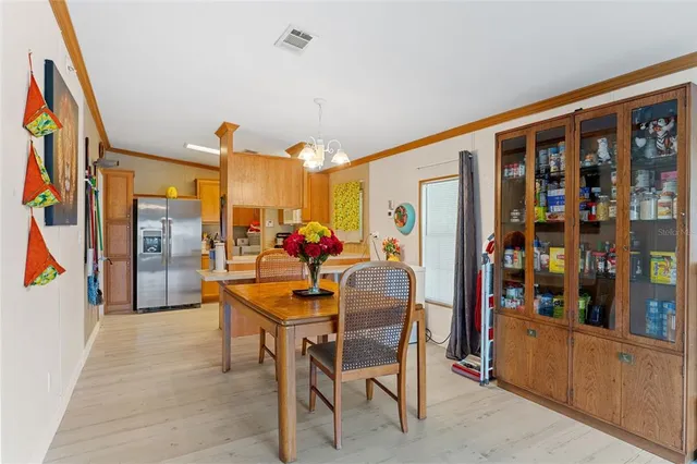 a dining room with furniture and a window