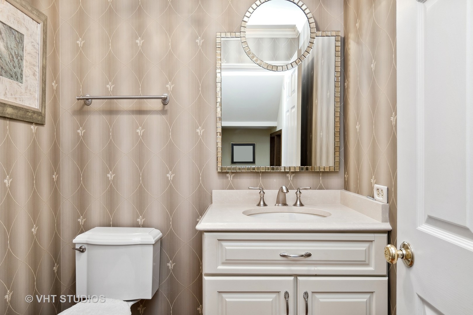 998 Landing Road Naperville, IL 60540 - Photo 16 of 18 a bathroom with a sink and a mirror