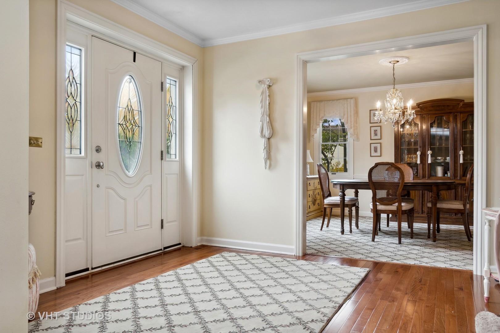 998 Landing Road Naperville, IL 60540 - Photo 2 of 18 a view of a dining room with furniture and chandelier