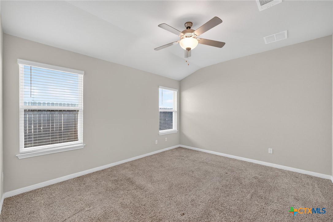900 Main Street Hutto, TX 78634 - Photo 14 of 23 a view of an empty room with a window