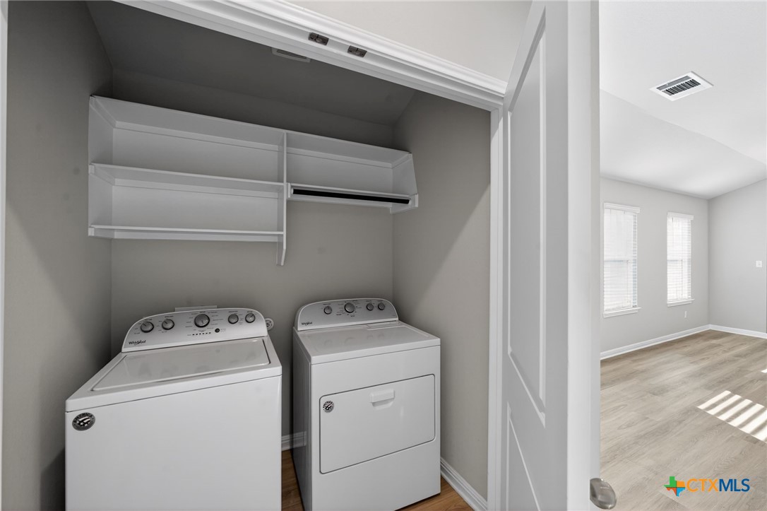 900 Main Street Hutto, TX 78634 - Photo 18 of 23 a utility room with dryer and washer