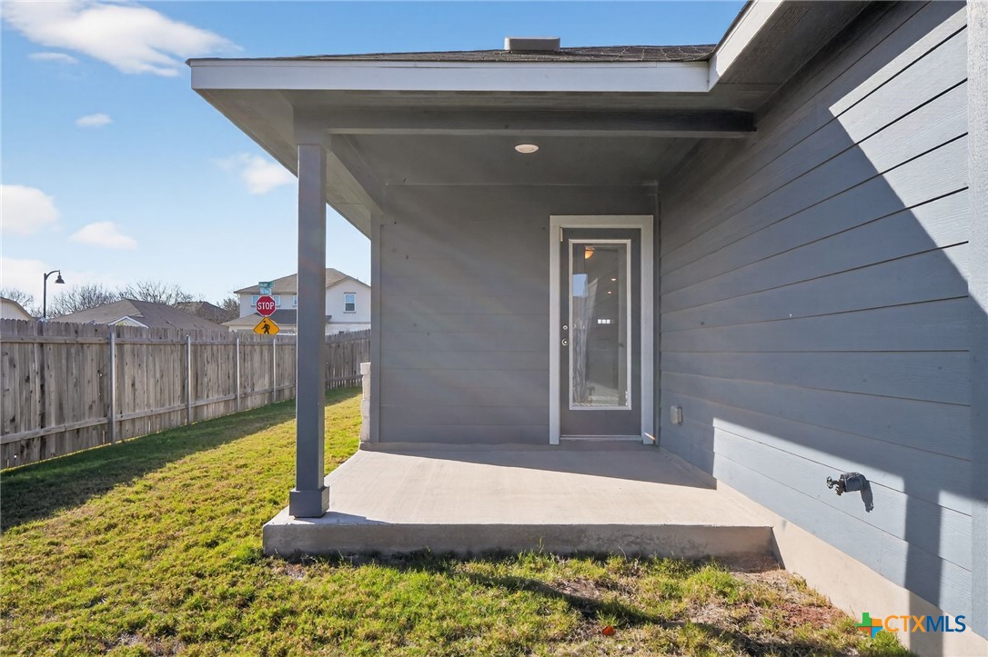 900 Main Street Hutto, TX 78634 - Photo 19 of 23 a front view of a house with a yard