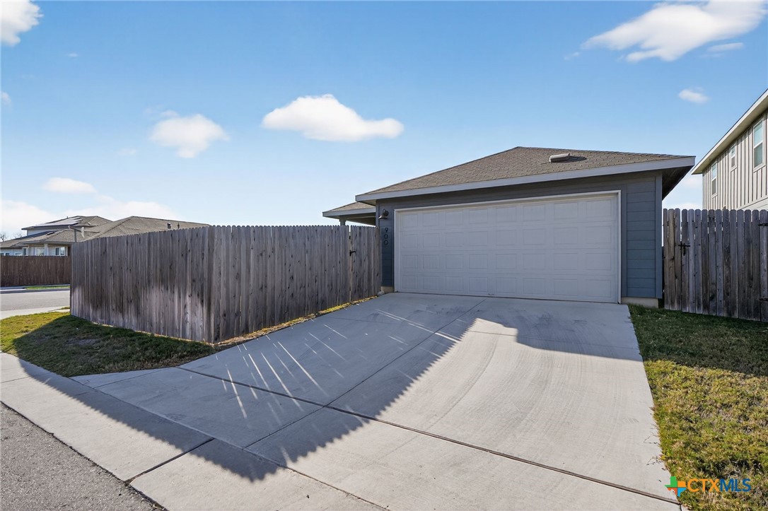 900 Main Street Hutto, TX 78634 - Photo 23 of 23 a view of backyard and wooden fence