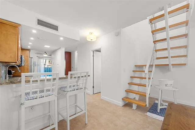 a kitchen with a sink cabinets and window