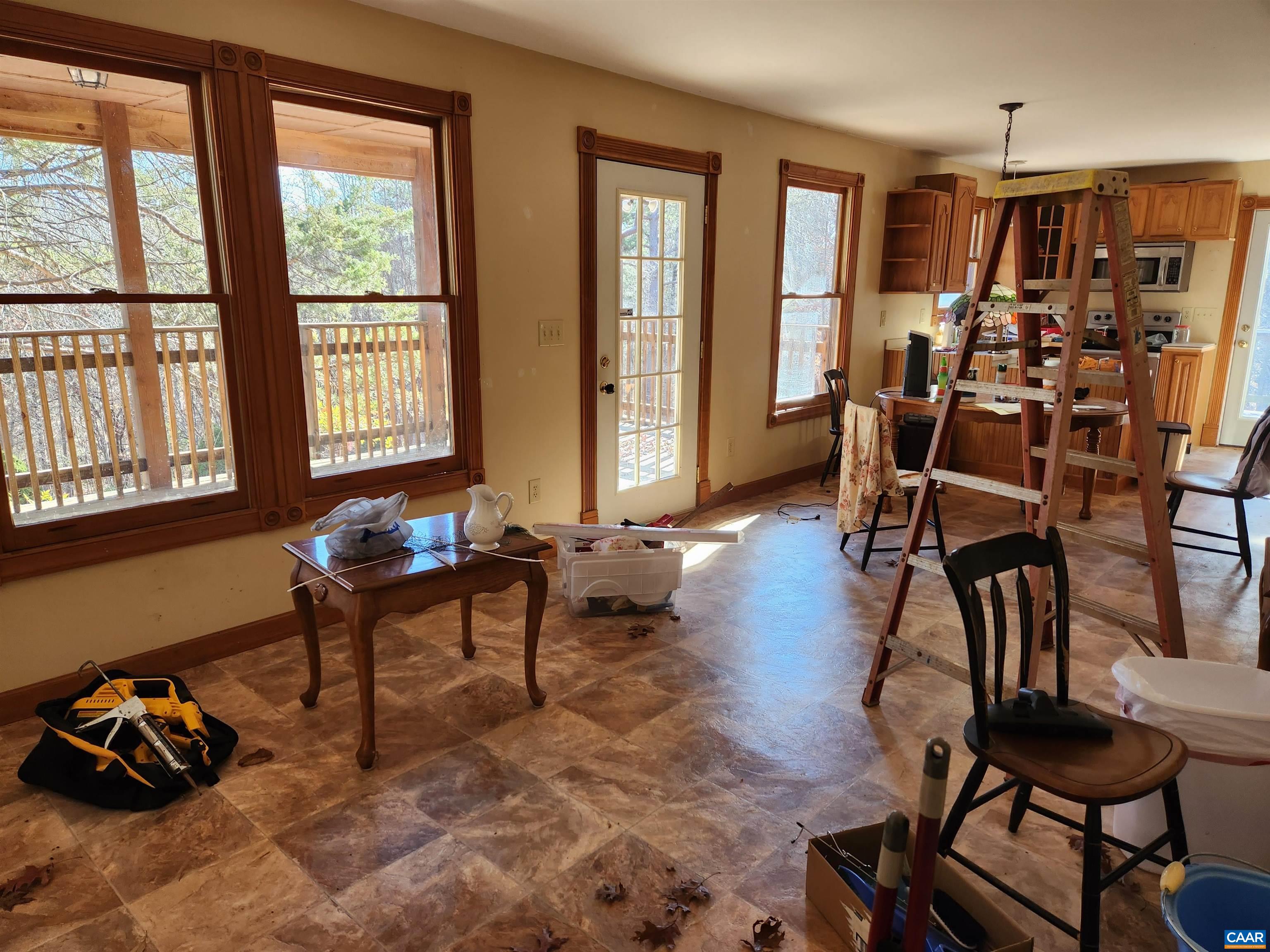 481 Rhodes School Lane Palmyra, VA 22963 - Photo 17 of 34 a living room filled with furniture and a window