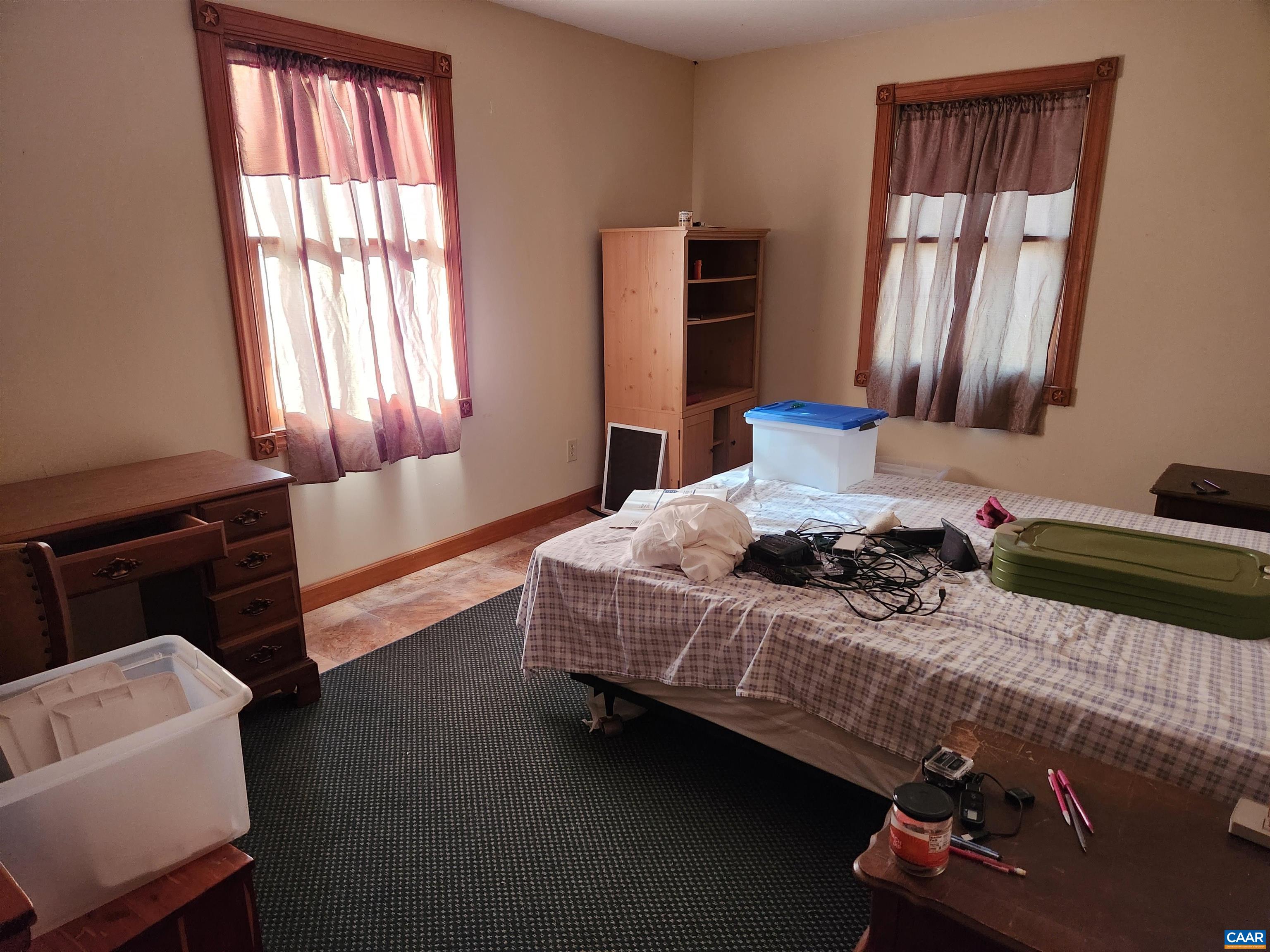 481 Rhodes School Lane Palmyra, VA 22963 - Photo 23 of 34 a bedroom with a bed and wooden floor