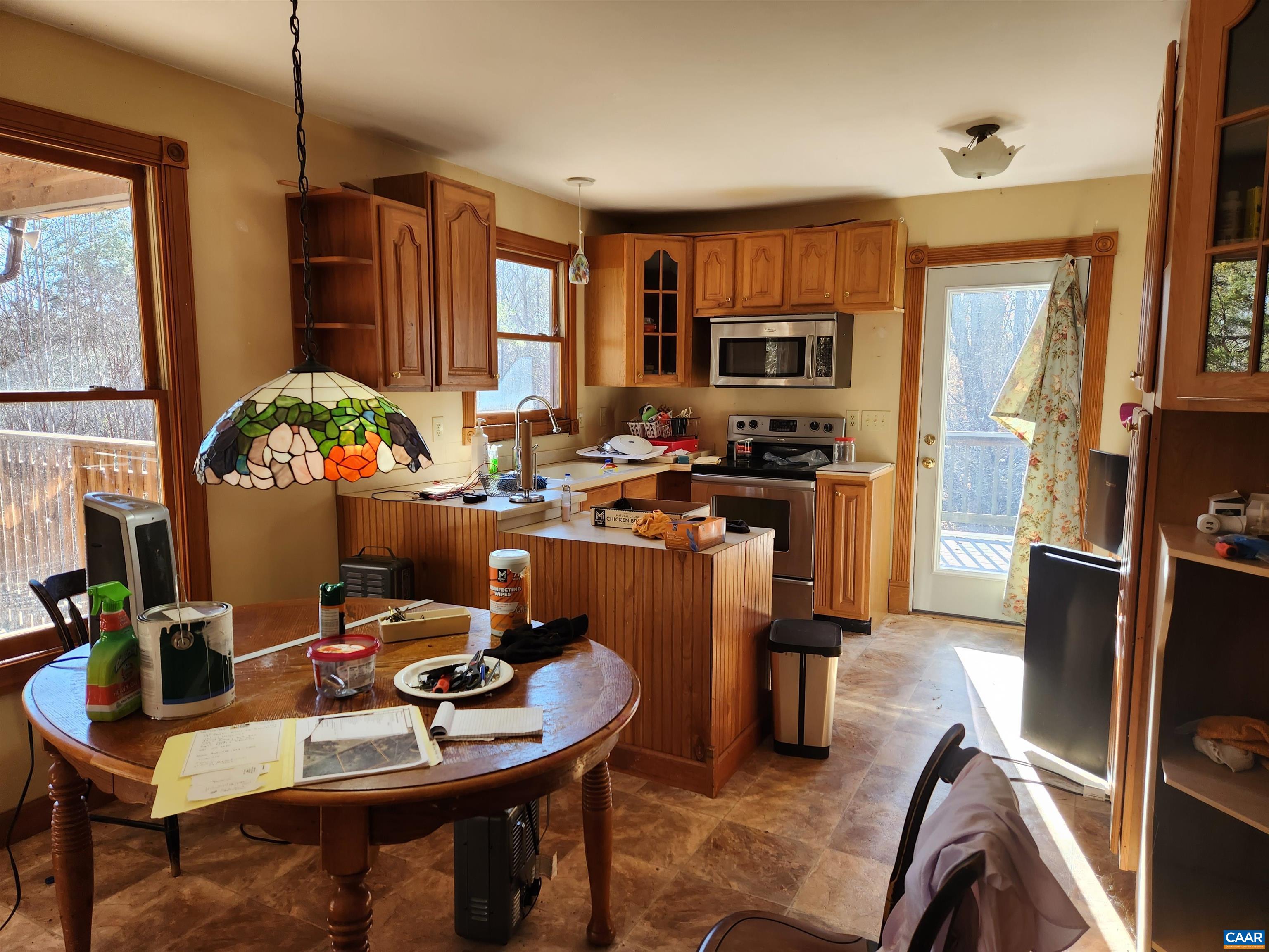 481 Rhodes School Lane Palmyra, VA 22963 - Photo 3 of 34 a view of a dining room with furniture window and wooden floor