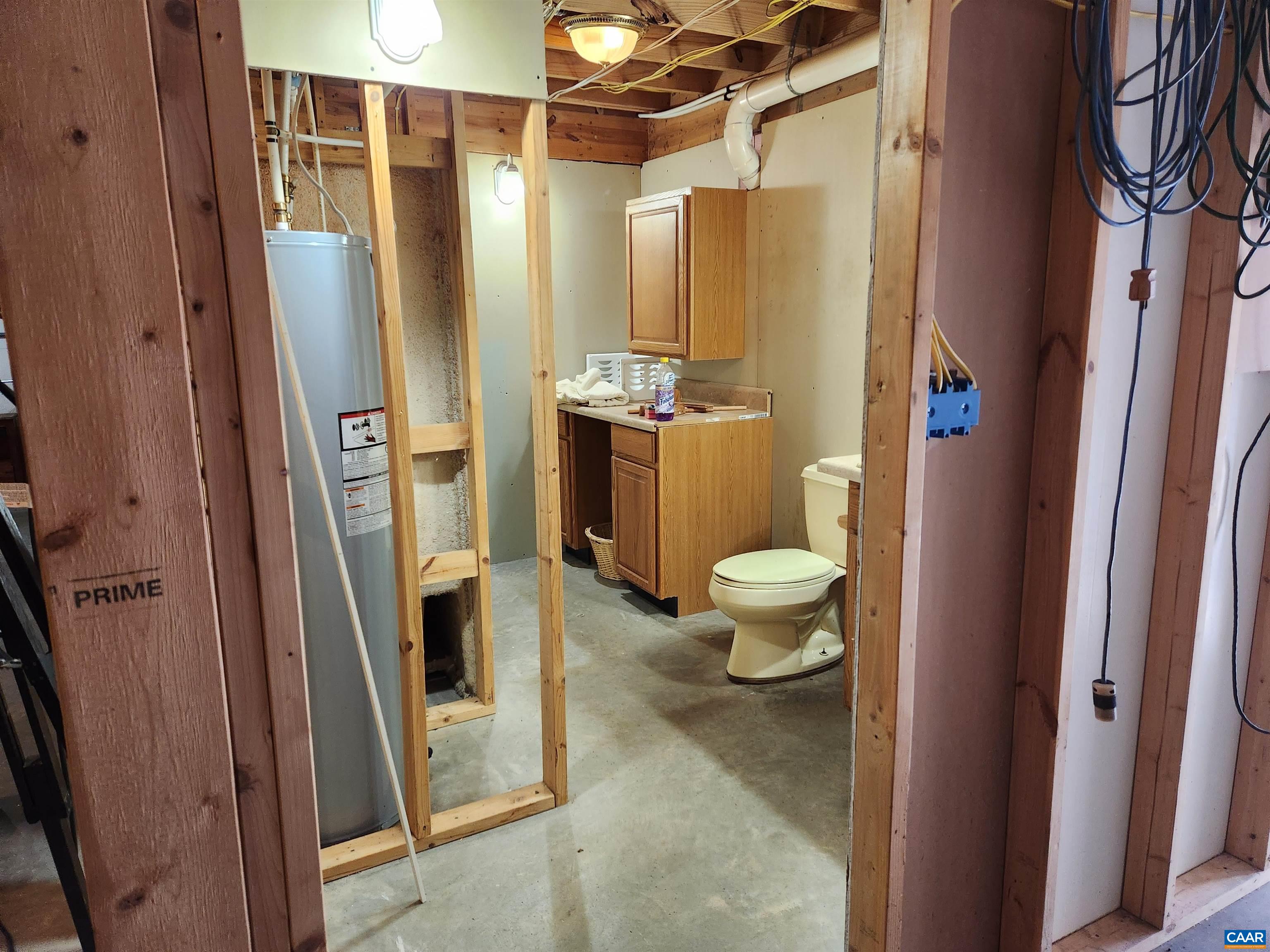 481 Rhodes School Lane Palmyra, VA 22963 - Photo 32 of 34 a bathroom with a granite countertop tub and a shower