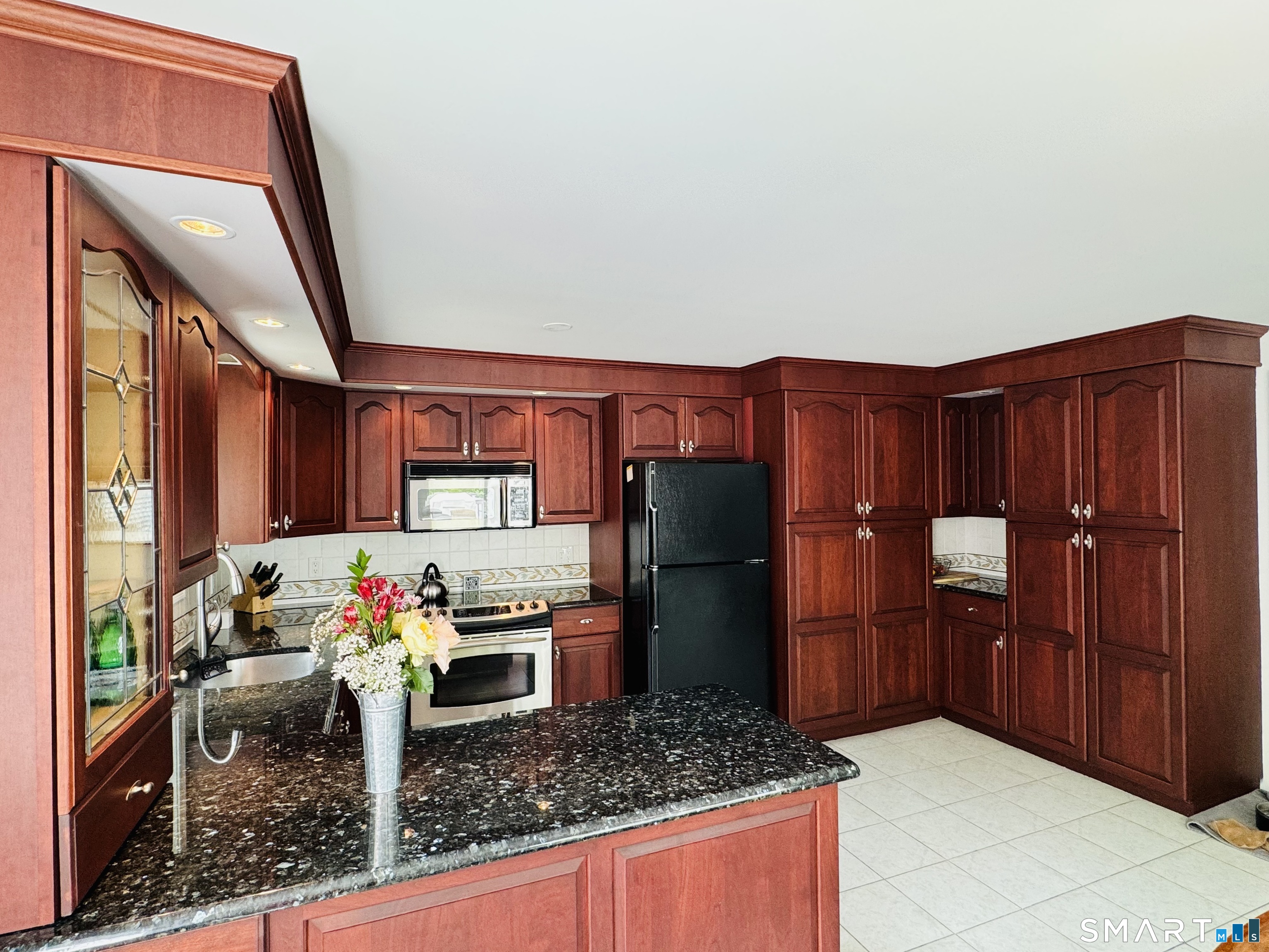 1514 Woodtick Road Wolcott, CT 06716 - Photo 6 of 23 a kitchen with granite countertop lots of counter top space and stainless steel appliances
