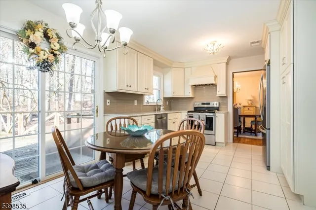 a spacious bedroom with a bed and wooden floor
