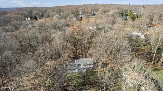 a living room with furniture and large windows