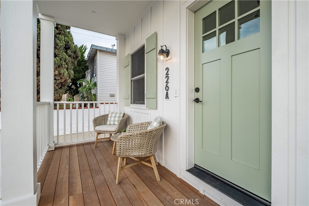 226 A Arena Street El Segundo, CA 90245 - Photo 14 of 47 a view of a chair and table in the front of a house