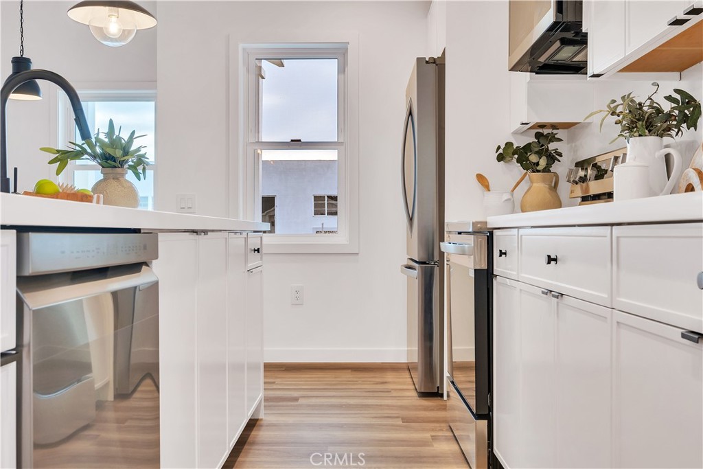 226 A Arena Street El Segundo, CA 90245 - Photo 28 of 47 a view of kitchen with cabinets and wooden floor