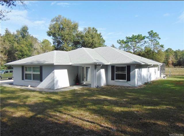 3727 North Boxelder Way Beverly Hills, FL 34465 - Photo 1 of 1 a house with green field in front of it
