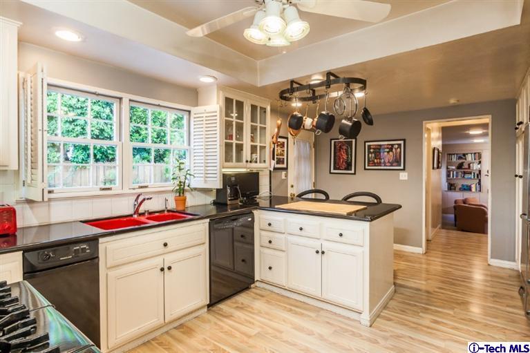 520 Bellmore Way Pasadena, CA 91103 - Photo 12 of 31 a kitchen with a sink stove and cabinets