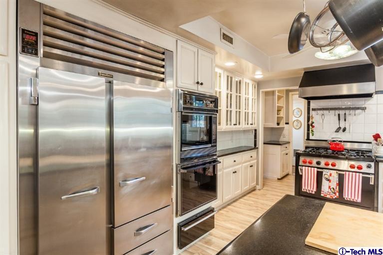 520 Bellmore Way Pasadena, CA 91103 - Photo 14 of 31 a kitchen with stainless steel appliances granite countertop a refrigerator and a stove