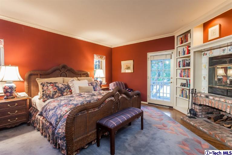 520 Bellmore Way Pasadena, CA 91103 - Photo 20 of 31 a bedroom with a bed and glass walk in closet