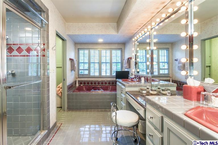 520 Bellmore Way Pasadena, CA 91103 - Photo 21 of 31 a bathroom with a sink a vanity and mirror