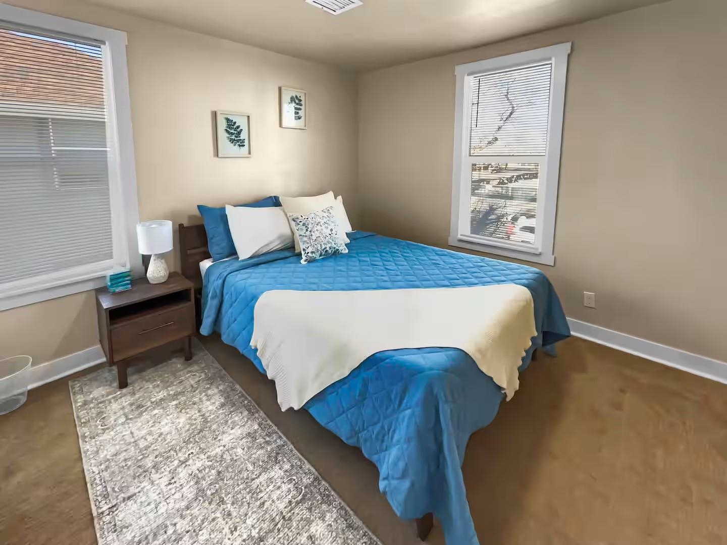 915 Grand Avenue Grand Junction, CO 81501 - Photo 15 of 24 a bedroom with a bed and a window