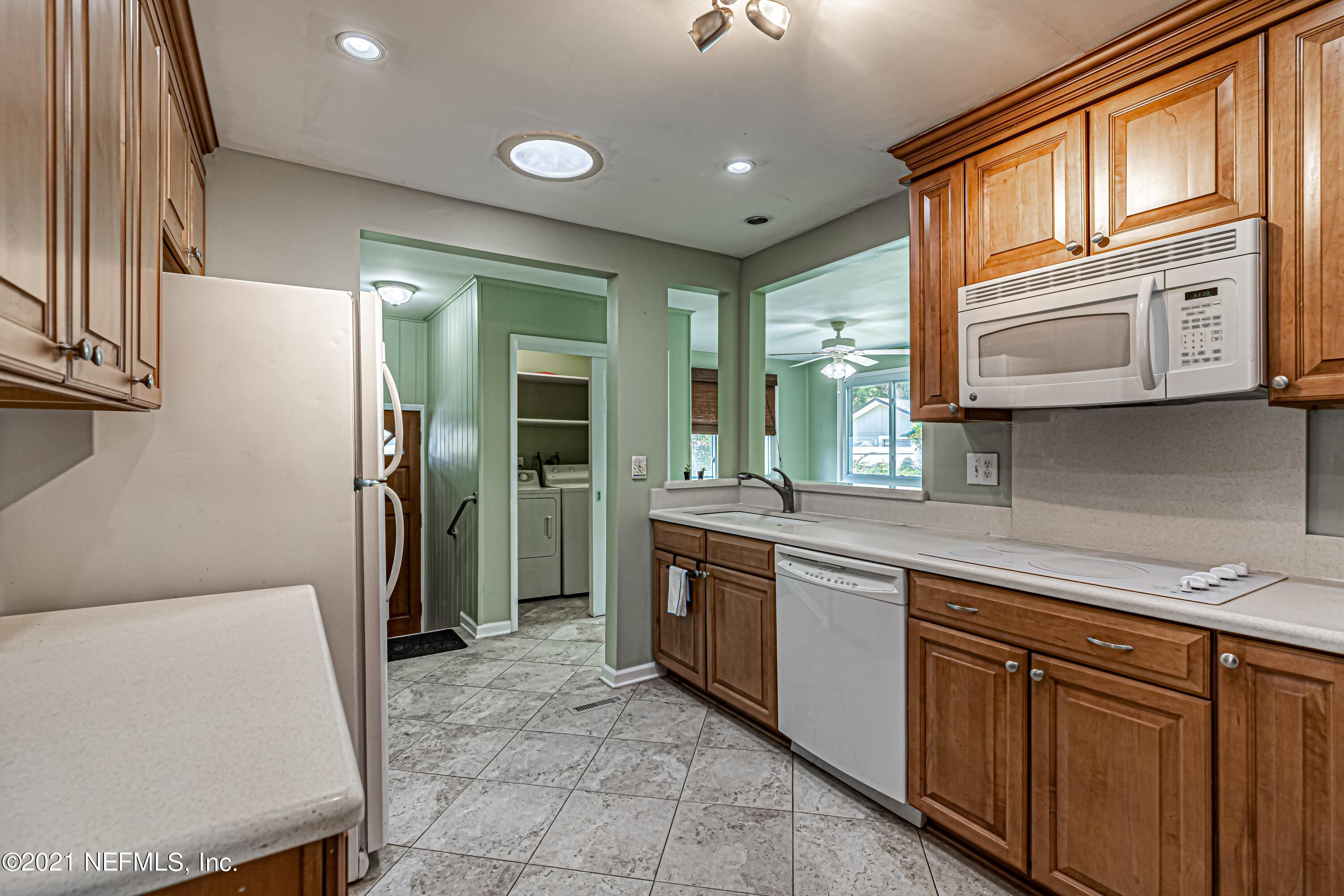 4627 Birkenhead Road Jacksonville, FL 32210 - Photo 12 of 30 a kitchen with stainless steel appliances granite countertop a refrigerator and a stove top oven