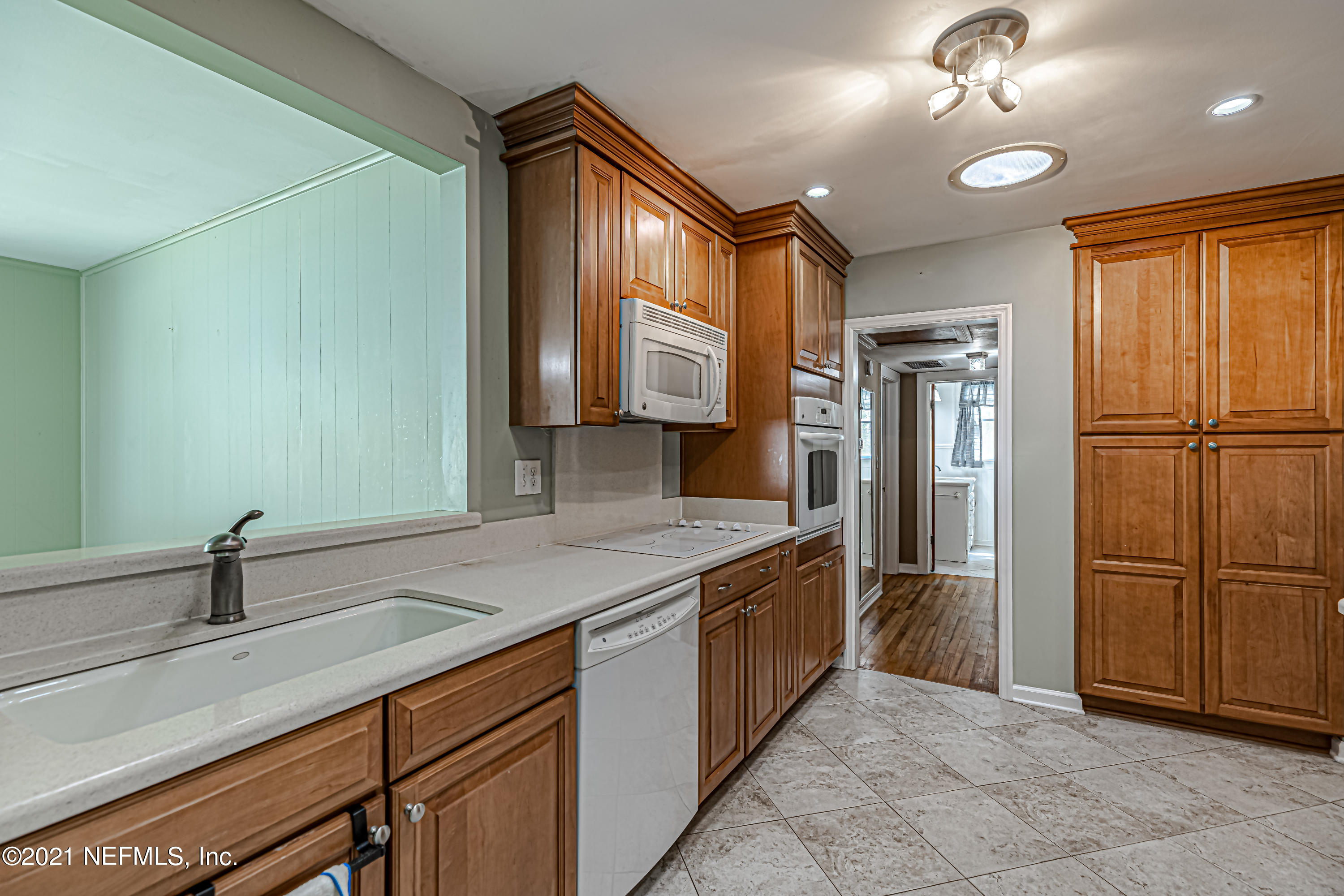 4627 Birkenhead Road Jacksonville, FL 32210 - Photo 13 of 30 a kitchen with stainless steel appliances granite countertop a refrigerator and a sink