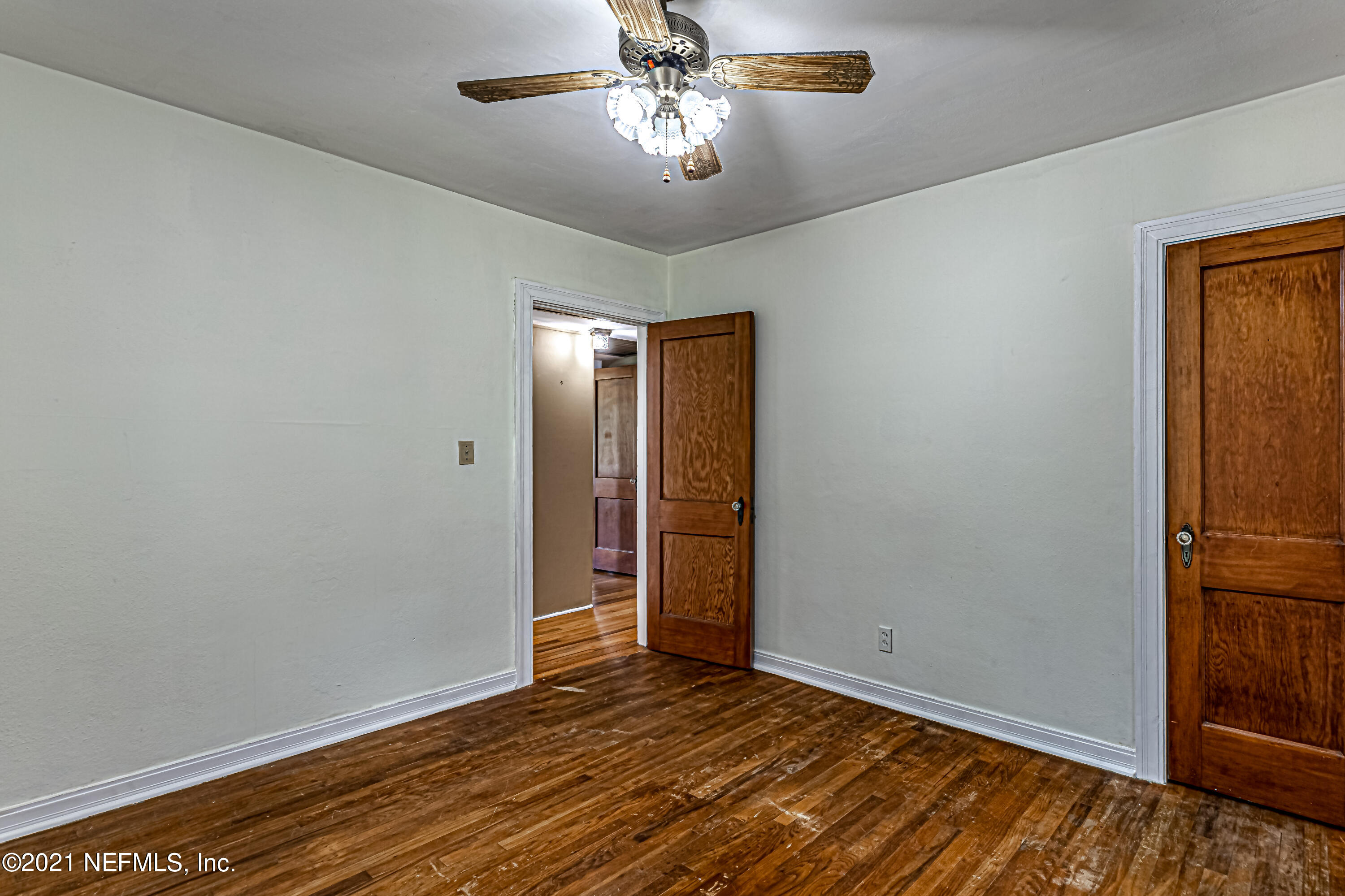 4627 Birkenhead Road Jacksonville, FL 32210 - Photo 20 of 30 a view of empty room with wooden floor
