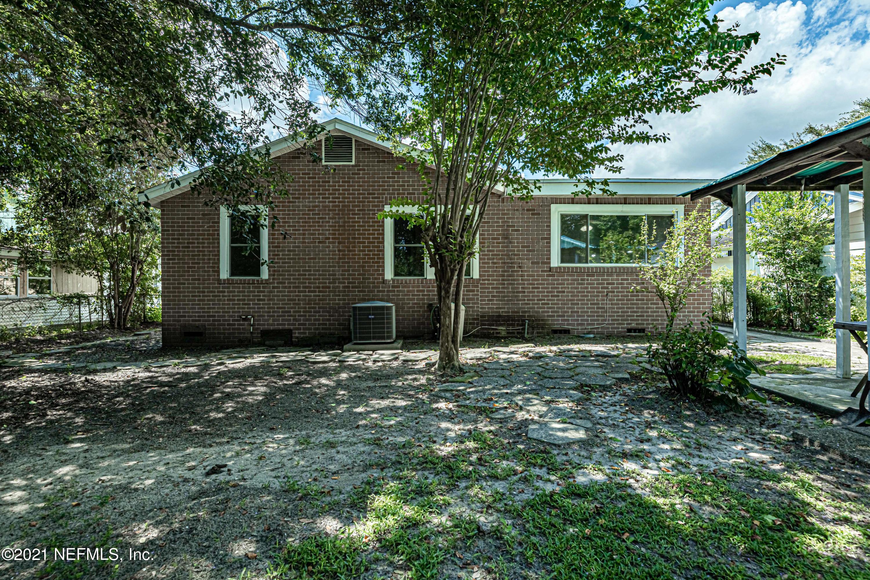 4627 Birkenhead Road Jacksonville, FL 32210 - Photo 24 of 30 a backyard of a house with lots of green space