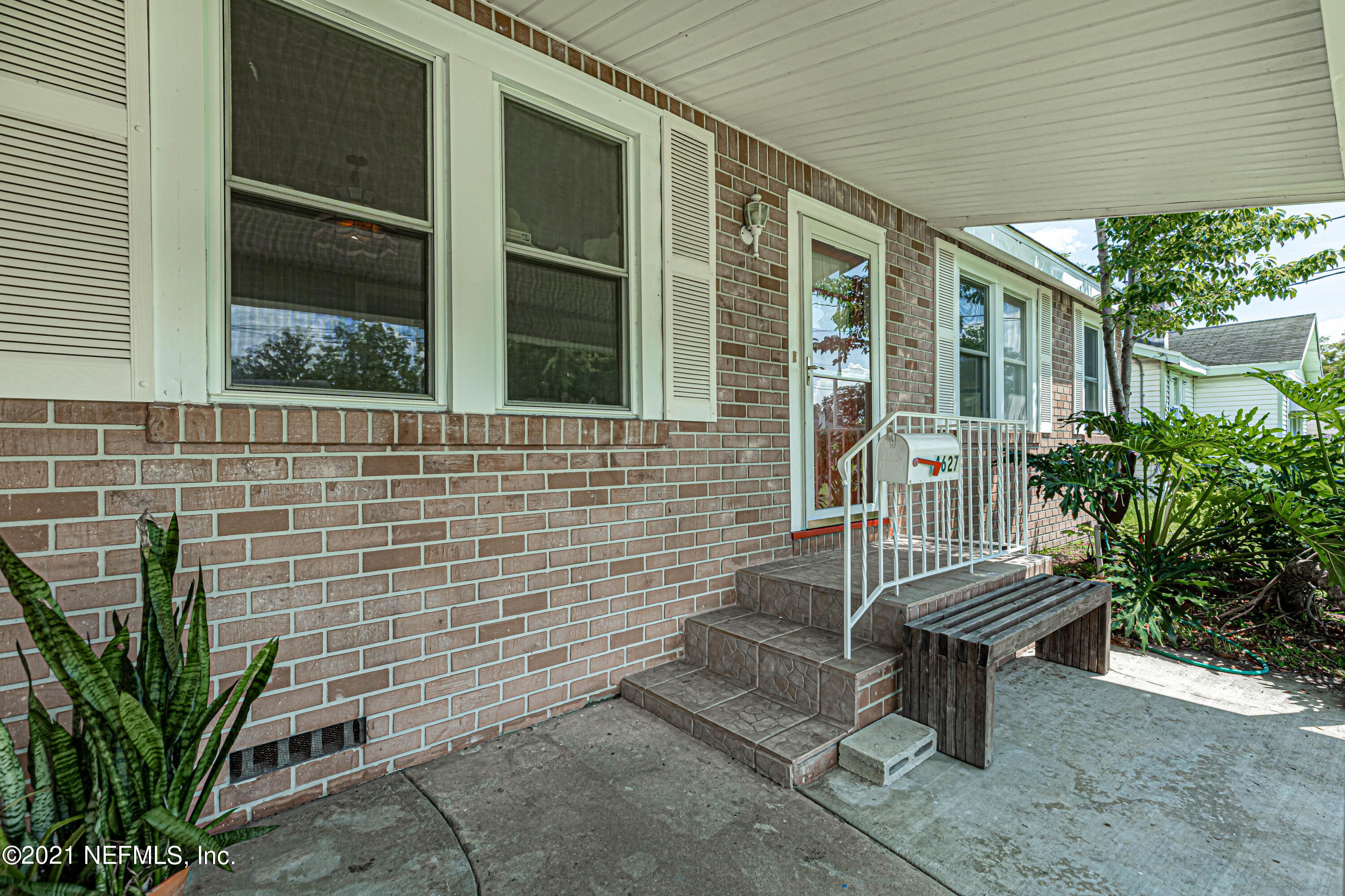 4627 Birkenhead Road Jacksonville, FL 32210 - Photo 4 of 30 a view of a bench in front of house