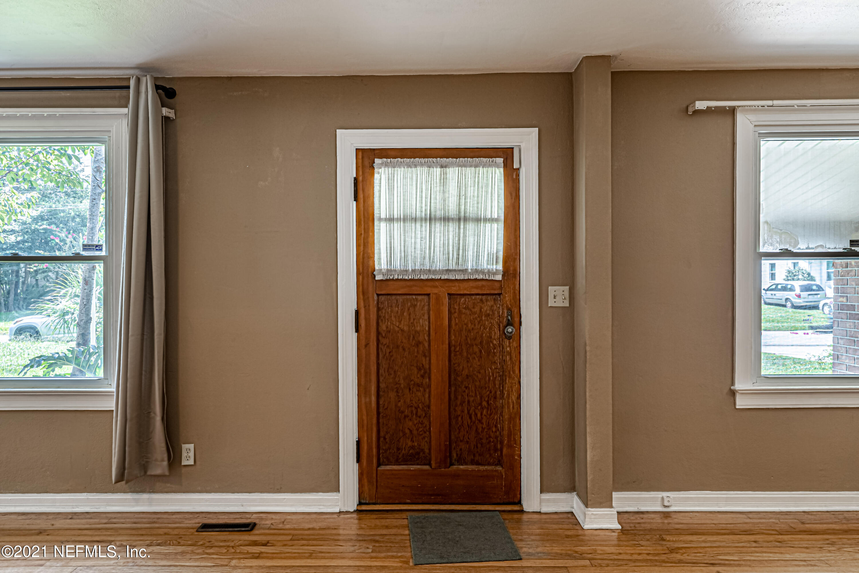 4627 Birkenhead Road Jacksonville, FL 32210 - Photo 5 of 30 a view of a livingroom with wooden floor and a window