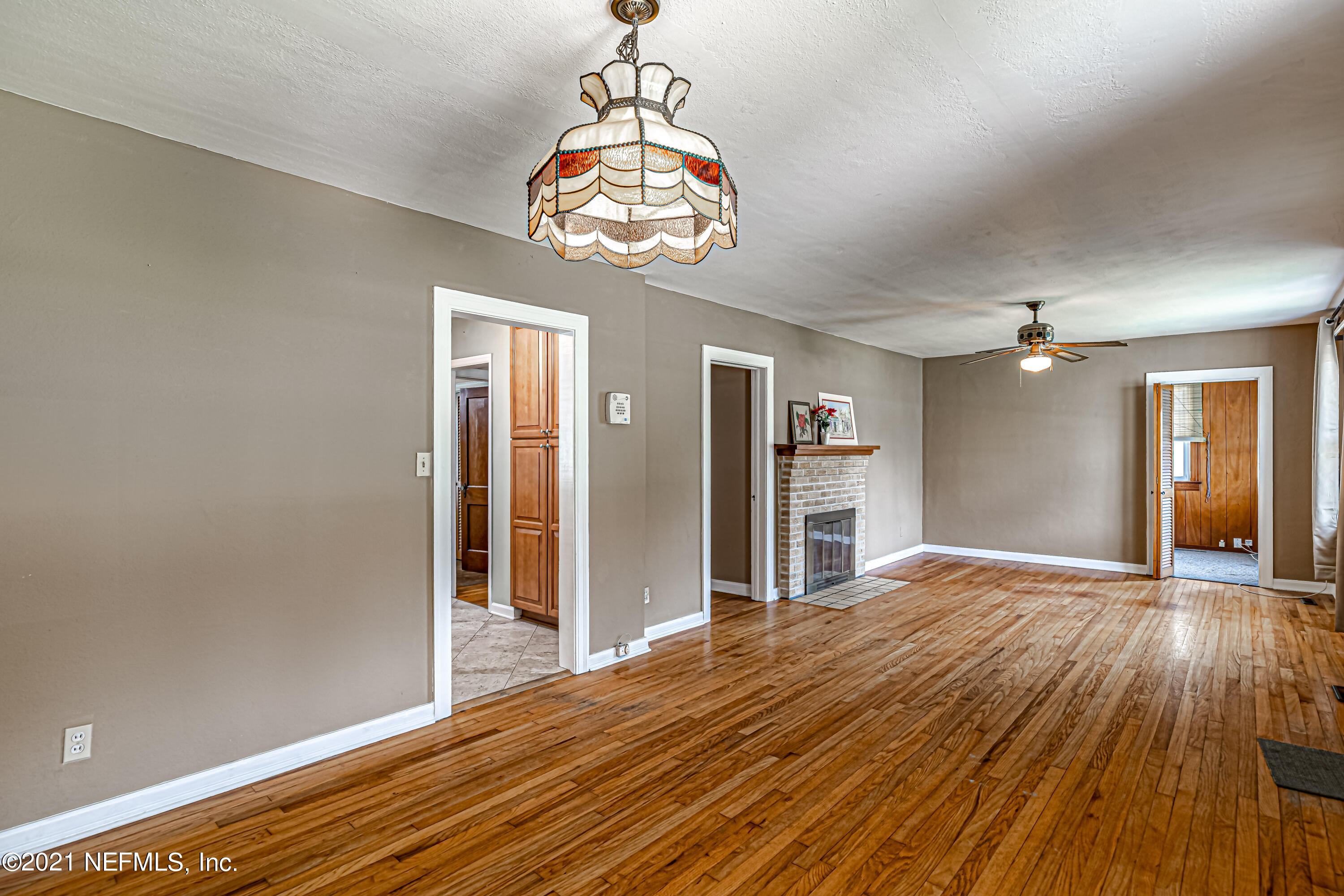 4627 Birkenhead Road Jacksonville, FL 32210 - Photo 6 of 30 a view of empty room with wooden floor