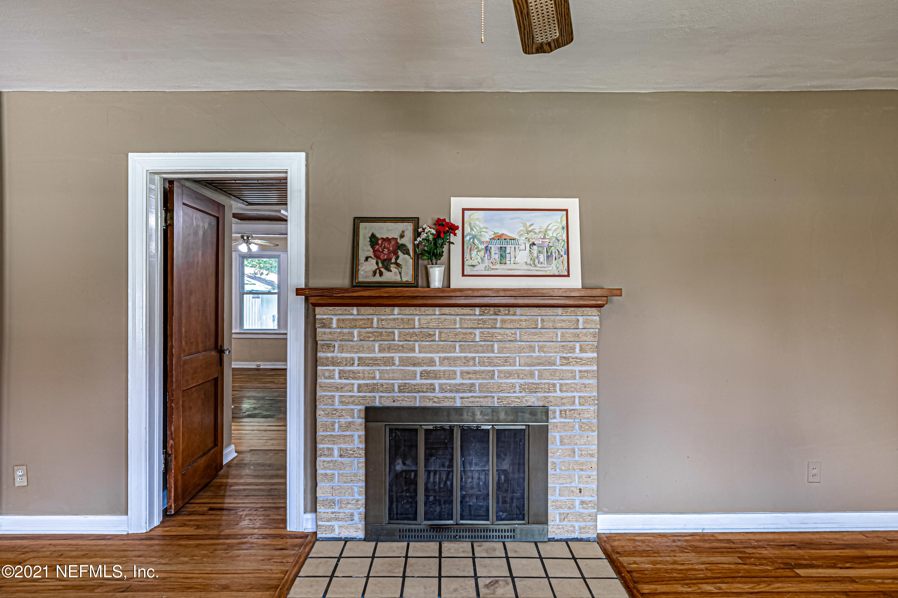 4627 Birkenhead Road Jacksonville, FL 32210 - Photo 9 of 30 a living room with furniture and a fireplace