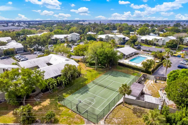 a aerial view of a house with a swimming pool yard and mountain view