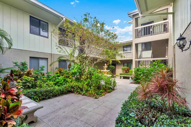 a view of a swimming pool with a yard