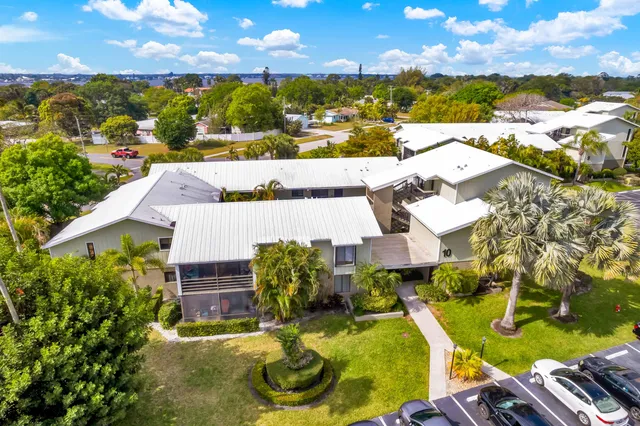 aerial view of a house with swimming pool and ocean view