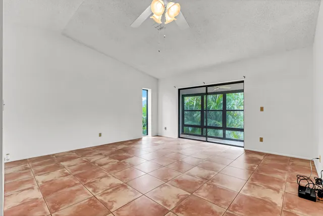 a view of a room with a bed and a white cabinet