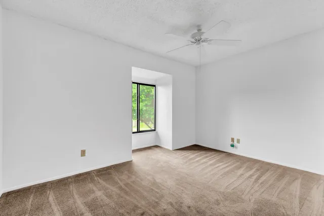 a bathroom with a toilet a sink and a mirror