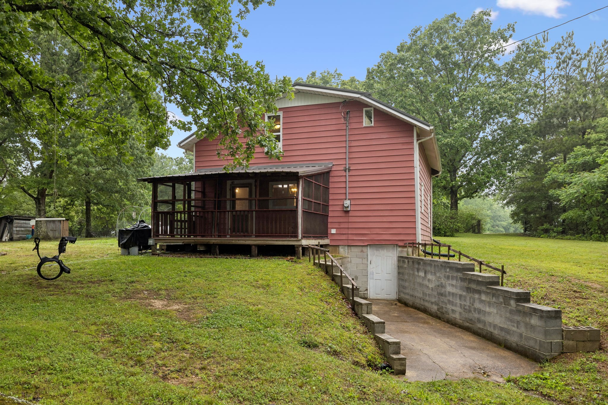 121 Hannah Road Summertown, TN 38483 - Photo 40 of 52 a view of a house with a yard