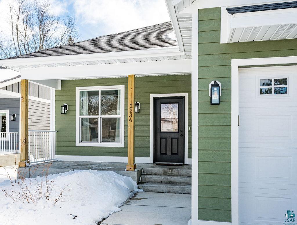 2236 Hoover Street Duluth, MN 55811 - Photo 3 of 52 Doorway to property featuring covered porch and a shingled roof