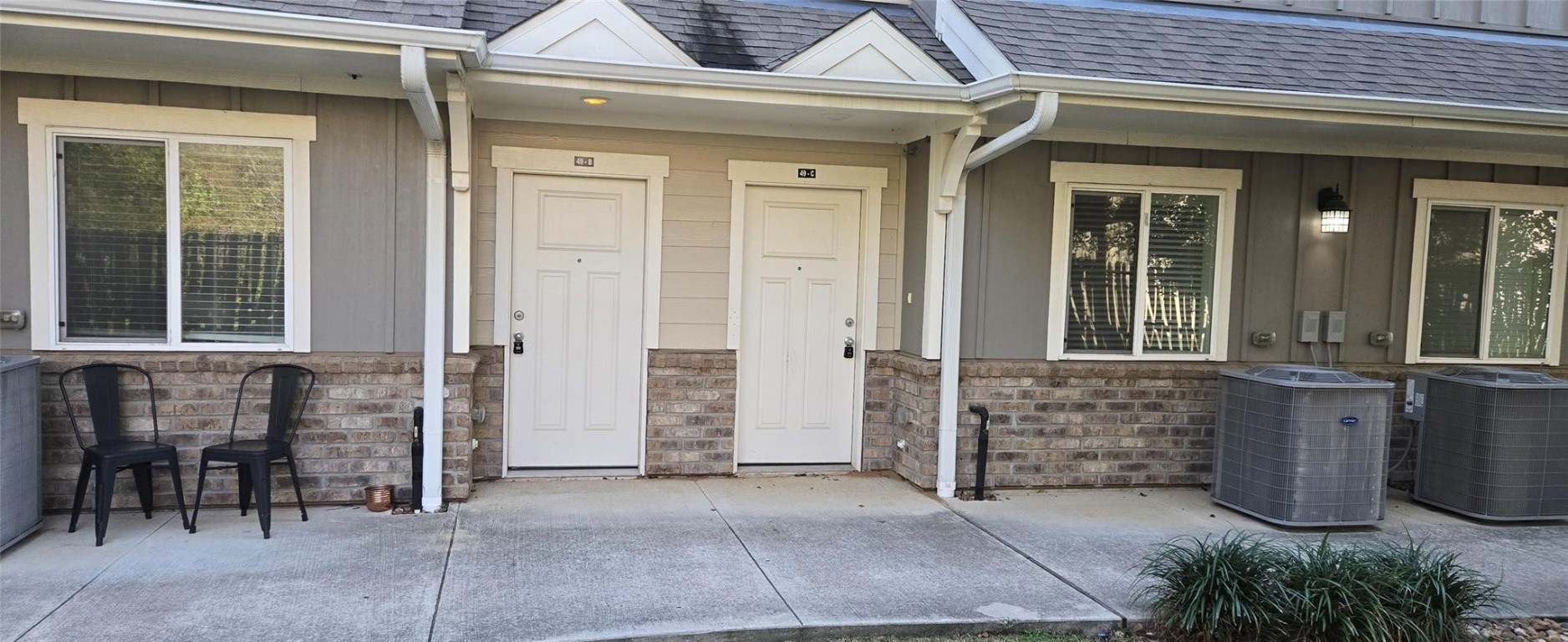 21155 Gosling Road, Unit 15 AB Spring, TX 77388 - Photo 5 of 30 Welcome to your new home, where a charming pathway lined with tidy landscaping guides you to the inviting front door, perfectly framed by modern architecture and natural beauty.