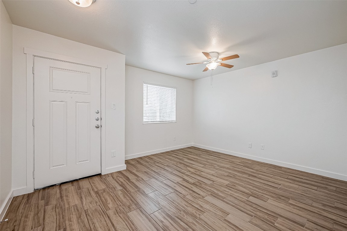 21155 Gosling Road, Unit 15 AB Spring, TX 77388 - Photo 6 of 30 This charming residence features a welcoming exterior with twin white doors and inviting windows, complemented by a cozy seating area that beckons you home.