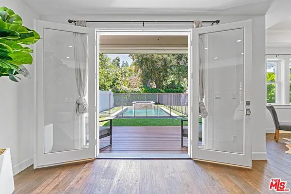 a view of front door and deck of the house