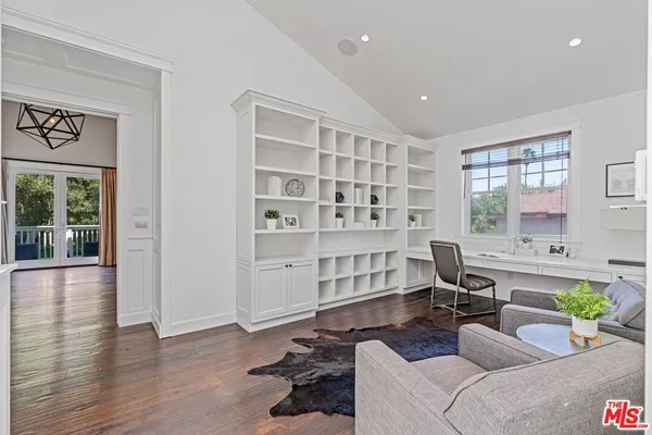a living room with furniture window and wooden floor