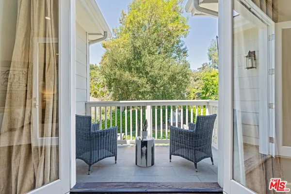 a view from deck with patio
