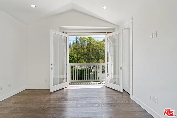 a view of entryway with wooden floor