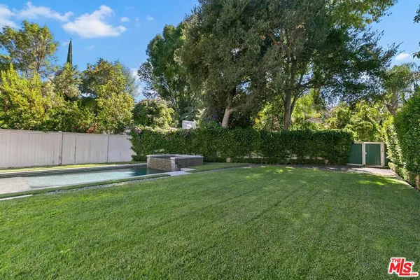 a swimming pool with wooden fence